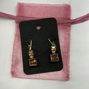 Amber Stones set in gold-toned metal, clasp back